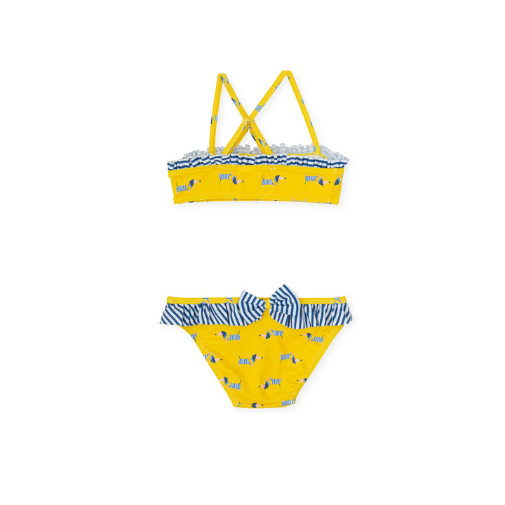 A vibrant yellow knitted bikini from the Tutto Piccolo kids' clothes line, designed with comfort and style in mind, perfect for a child's fun day at the beach or pool.