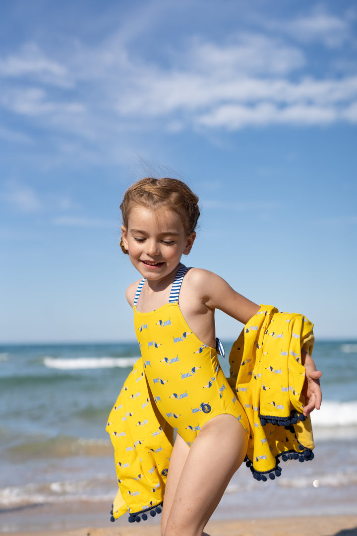 A sunny yellow knitted swimsuit from Tutto Piccolo, designed for baby girls, featuring a comfortable fit and playful design, perfect for beach days and swimming.