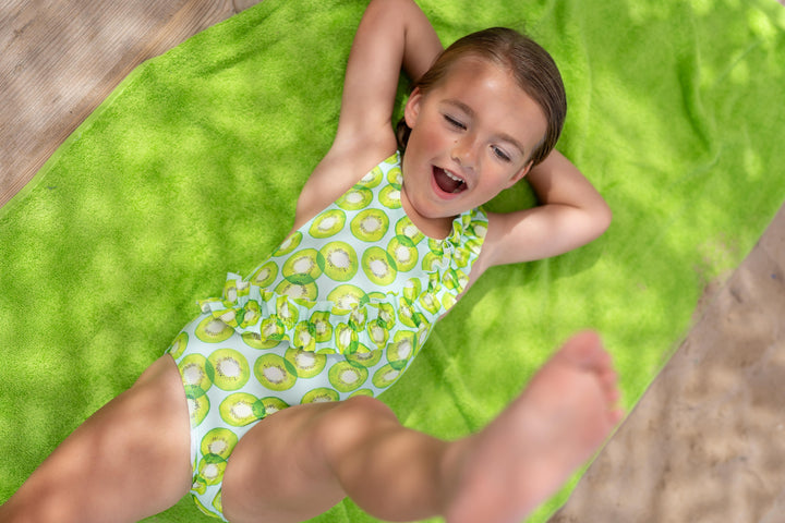 One-piece B Kickball knitted swimsuit for children in a striking lime green, designed for fun and comfort at the pool or beach.