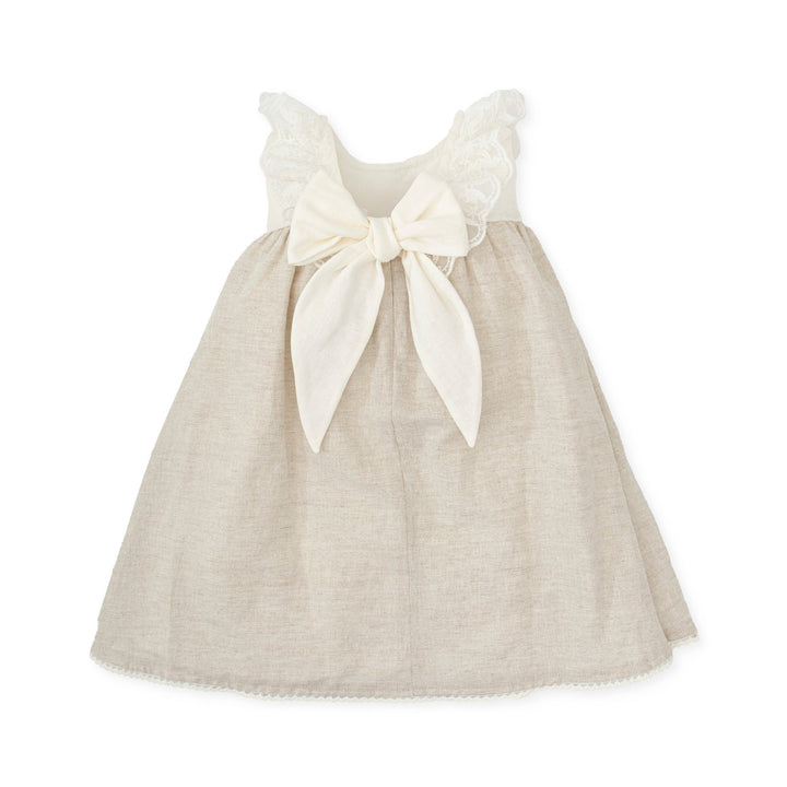 A chic sand-colored woven dress from the Tutto Piccolo kids' clothing line, offering a blend of elegance and comfort for baby girls, ideal for summer outings or special occasions.