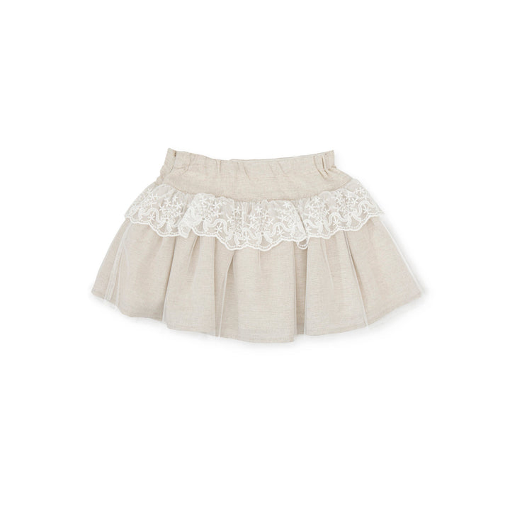 Sand-colored Kendo woven skirt for kids, offering a versatile and stylish summer wardrobe option with a relaxed fit.