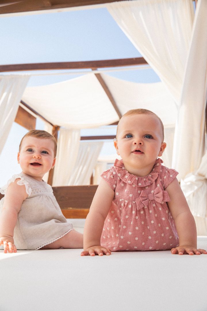 Petal pink Kendo baby woven dress with matching briefs set, featuring a delicate and soft design ideal for summer, adorned with subtle detailing for a touch of elegance.