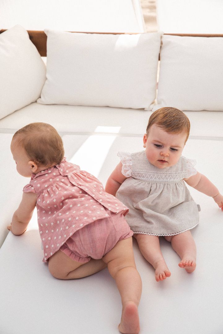 Petal pink Kendo baby woven dress with matching briefs set, featuring a delicate and soft design ideal for summer, adorned with subtle detailing for a touch of elegance.