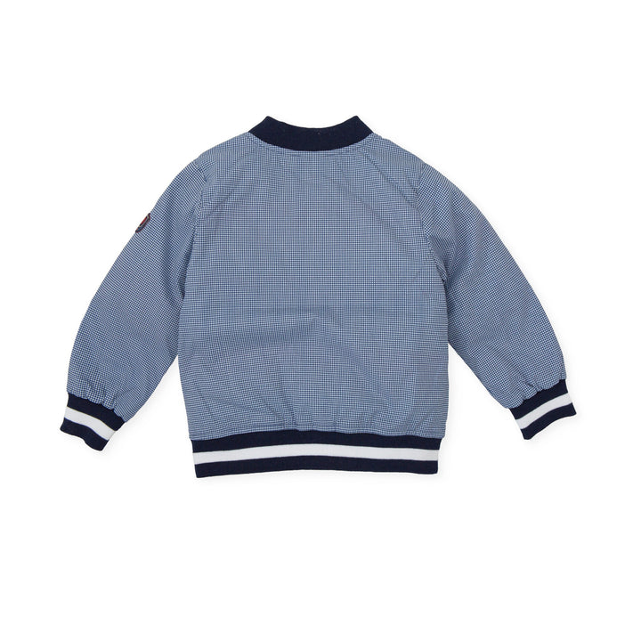 A classic navy blue knitted jacket from Tutto Piccolo, providing a versatile and stylish layering option for children's outfits, perfect for cooler summer evenings.