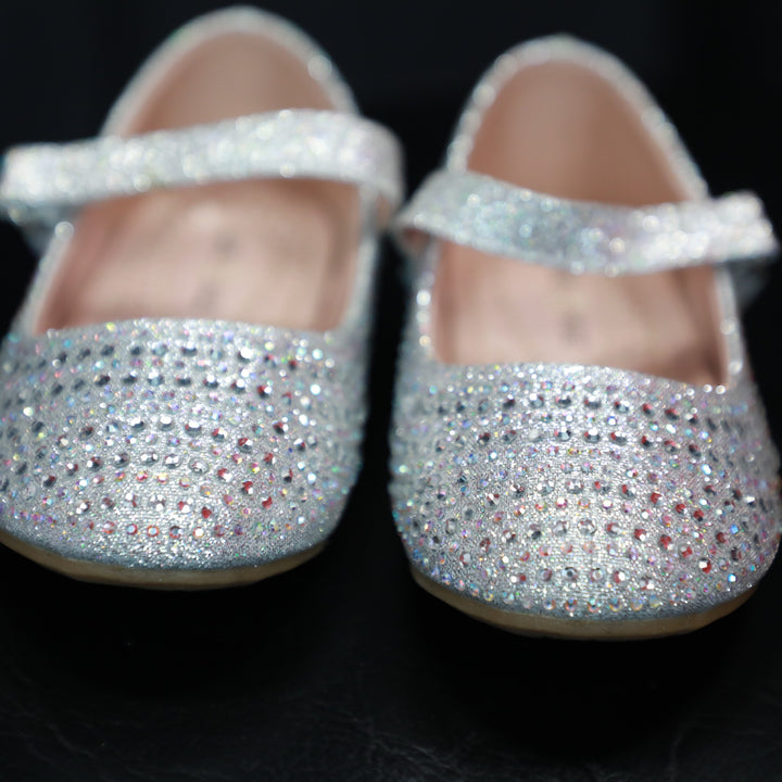 Sparkling silver Mary Jane shoes for baby girls.